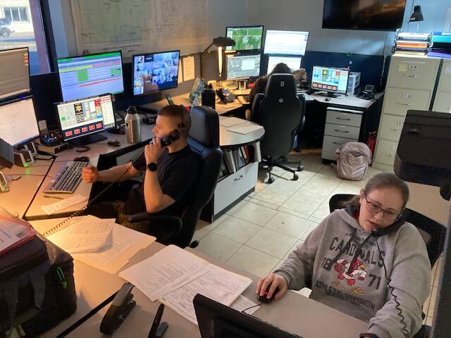 Three Dispatchers at their console 