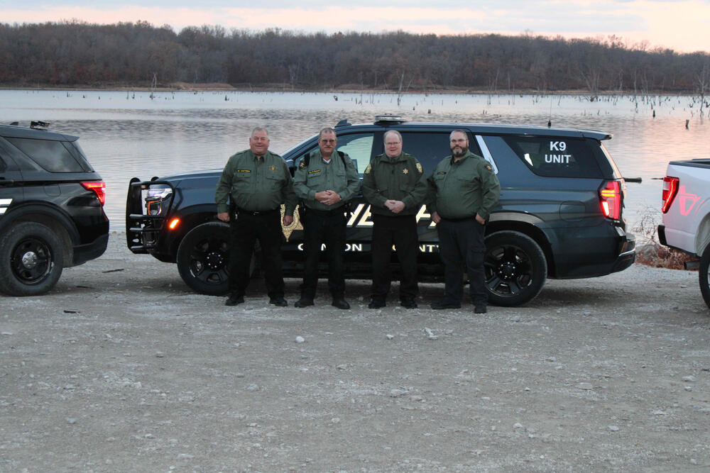 Clinton County Detention Deputies in front of vehicle